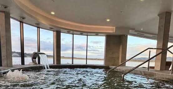 Indoor spa pool with panoramic water views
